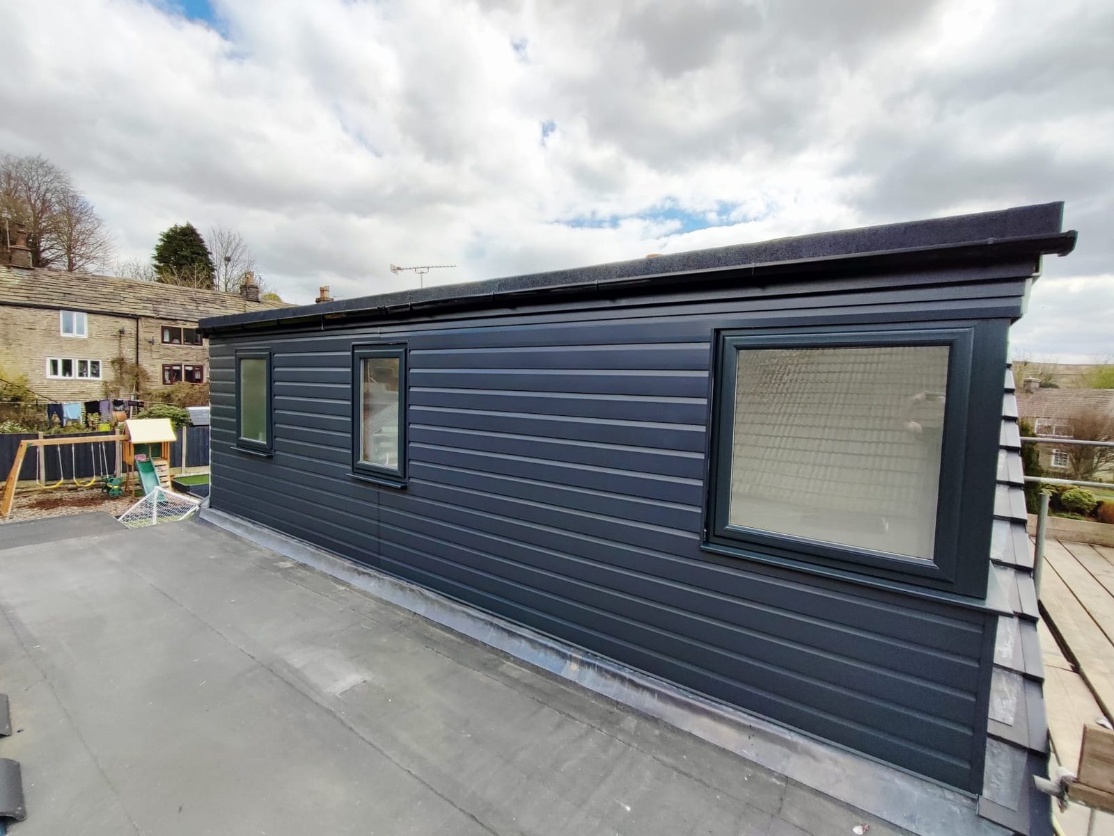 Finished grey-clad dormer loft conversion in Whitworth