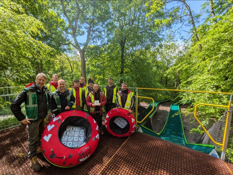 The Honeyman team on the completed tubing slide platform, built for Zip World